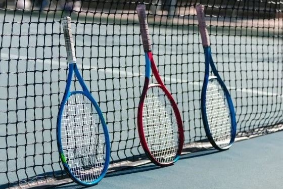 Picture of tennis rackets against net